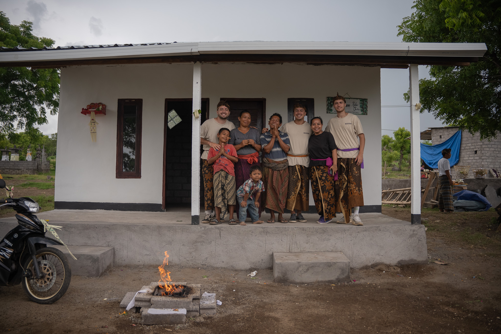 A family with the Rescue 2000 team in front of their finished home